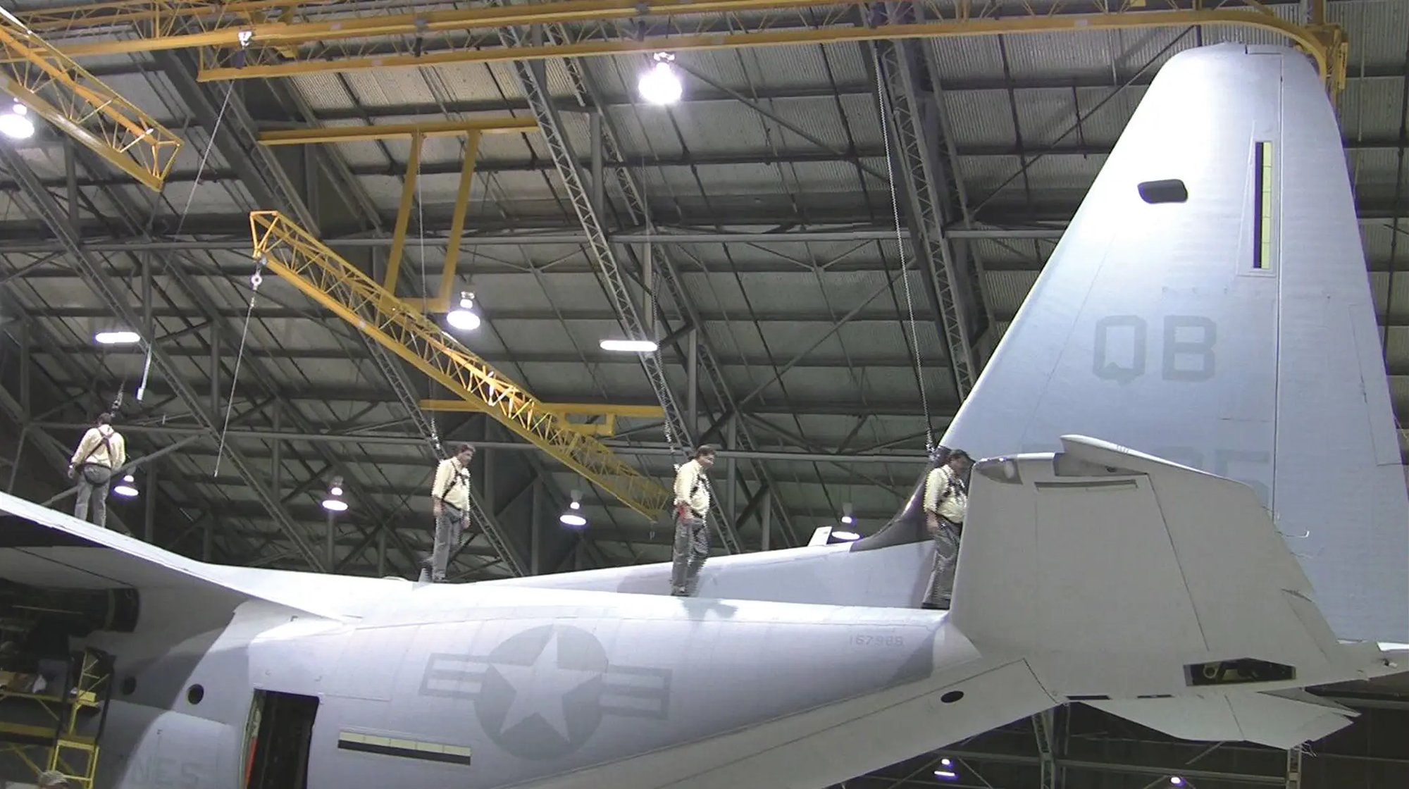 Aircraft hangar overhead rigid rail system